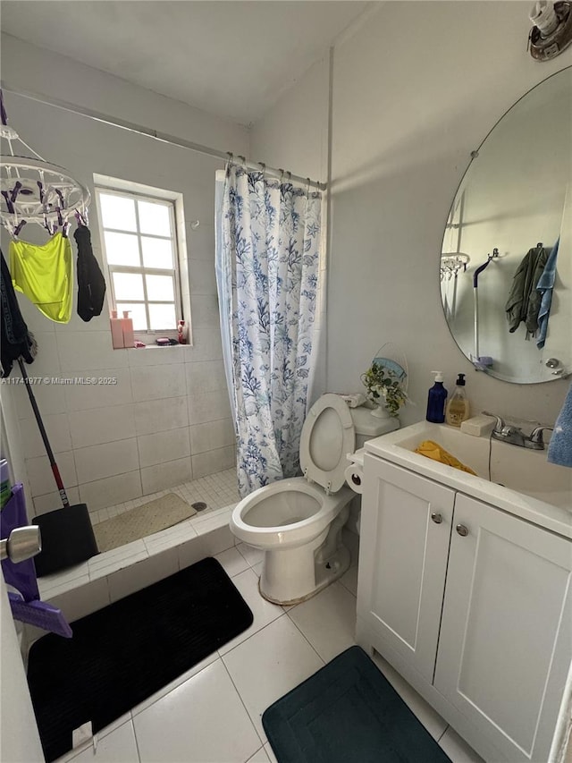 bathroom with walk in shower, tile patterned floors, toilet, and vanity