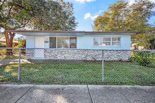 ranch-style home with a front yard