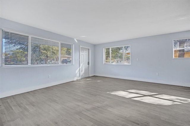 unfurnished room with light hardwood / wood-style floors