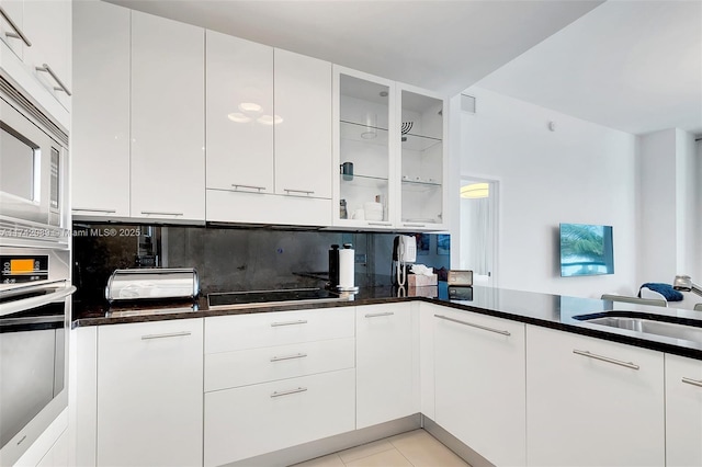 kitchen featuring white cabinetry, appliances with stainless steel finishes, and sink