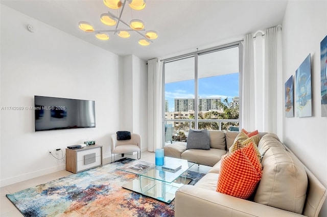 living room with tile patterned flooring, floor to ceiling windows, and a chandelier