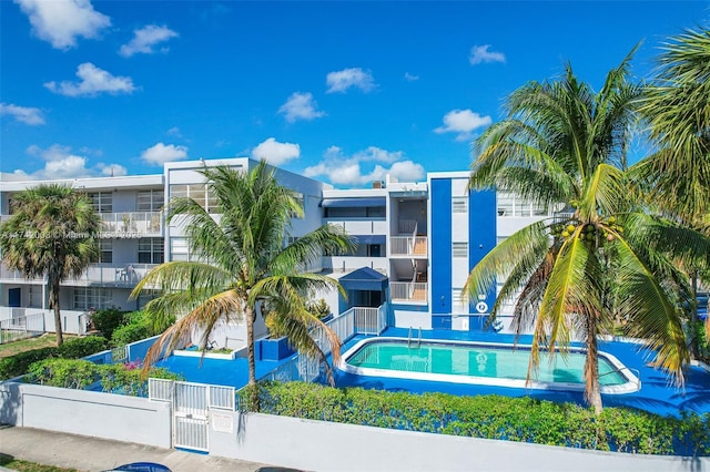 view of property featuring a community pool