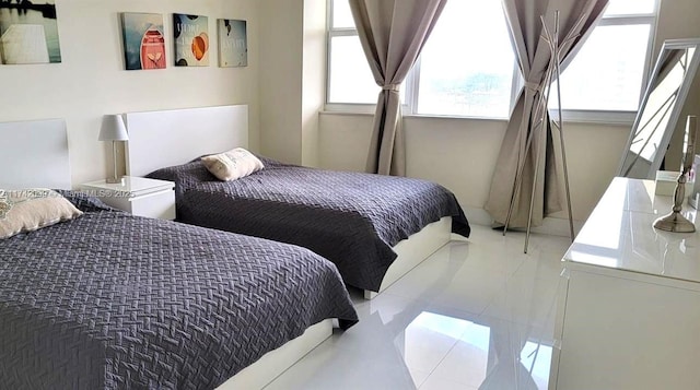 bedroom with tile patterned floors