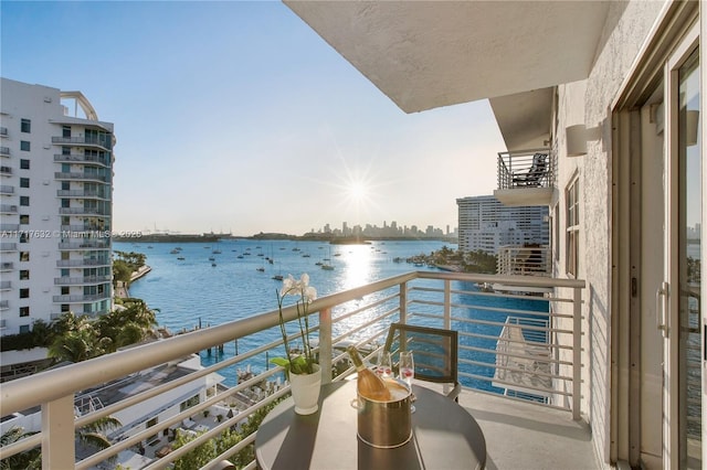 balcony featuring a water view