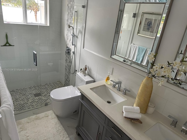 bathroom featuring toilet, tasteful backsplash, tile walls, vanity, and a shower with door