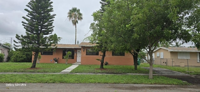 view of front of property with a front lawn