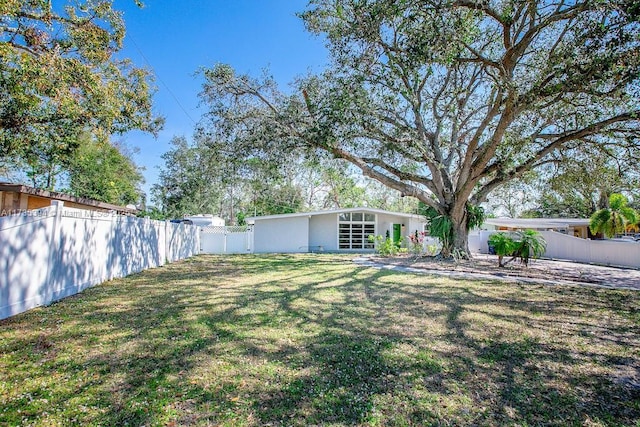 view of yard with a fenced backyard