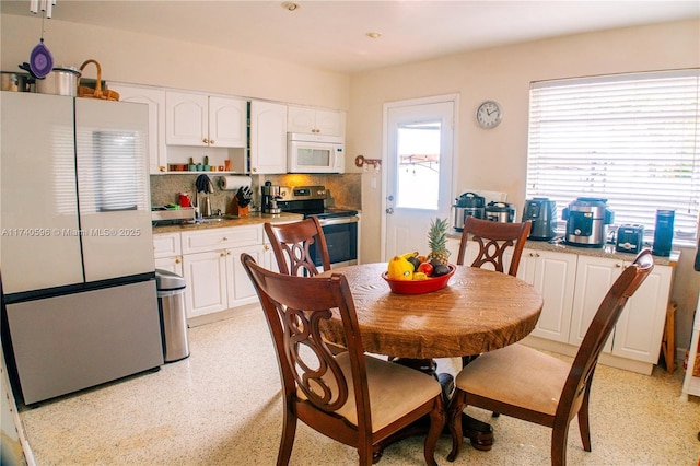 dining area featuring sink