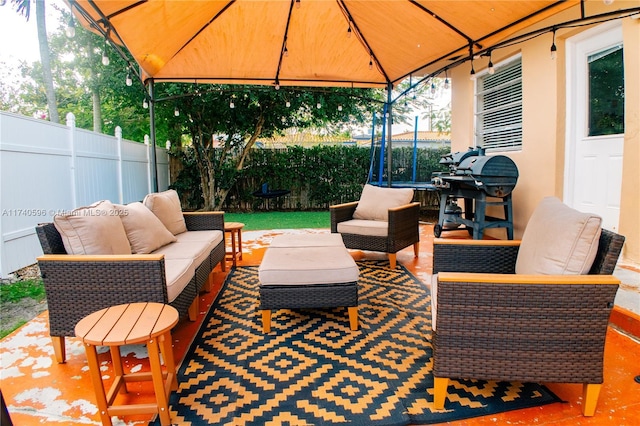 view of patio / terrace featuring an outdoor living space, a gazebo, and area for grilling