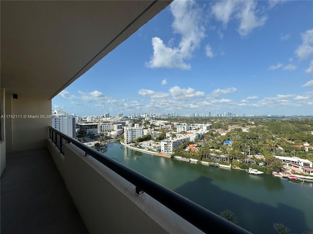 balcony with a water view and a city view