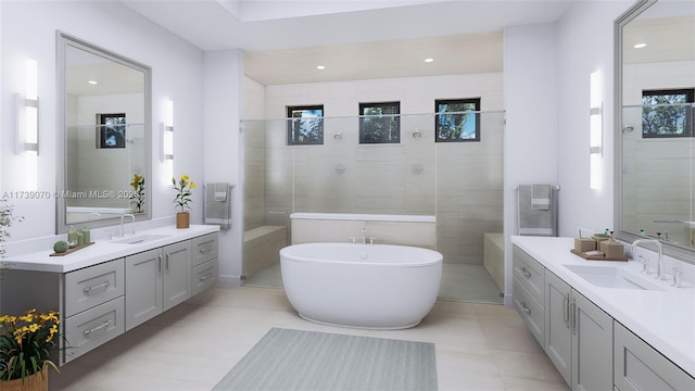 bathroom featuring a freestanding tub, two vanities, and a sink