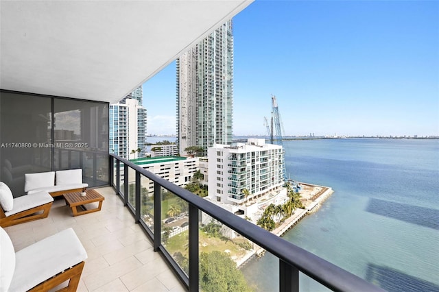 balcony featuring a water view