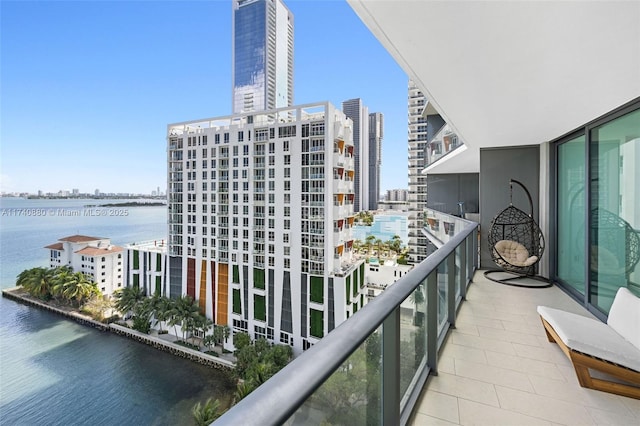 balcony featuring a water view