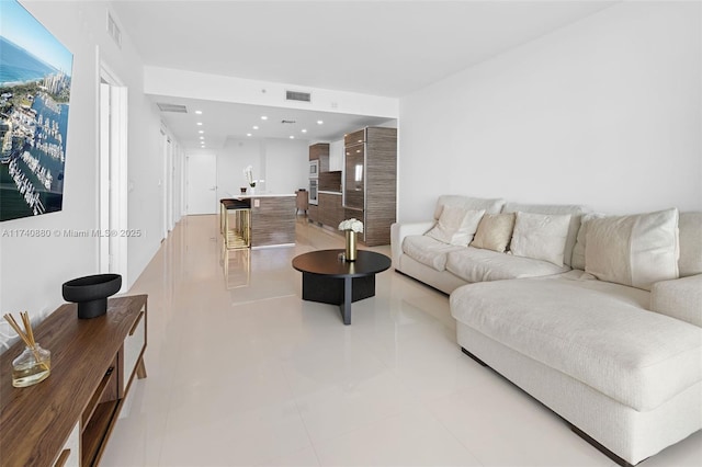 living room with light tile patterned floors