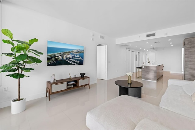 living room featuring light tile patterned floors