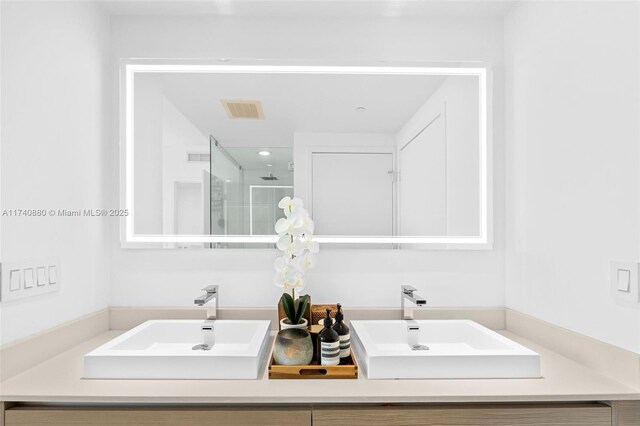 460 NE 28th St Unit 1404, Miami, FL 33137 - bathroom featuring a stall shower, double vanity, and recessed lighting