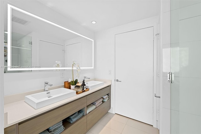 bathroom featuring vanity, tile patterned flooring, and a shower with shower door