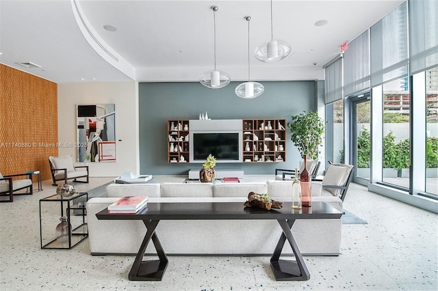 living room with floor to ceiling windows