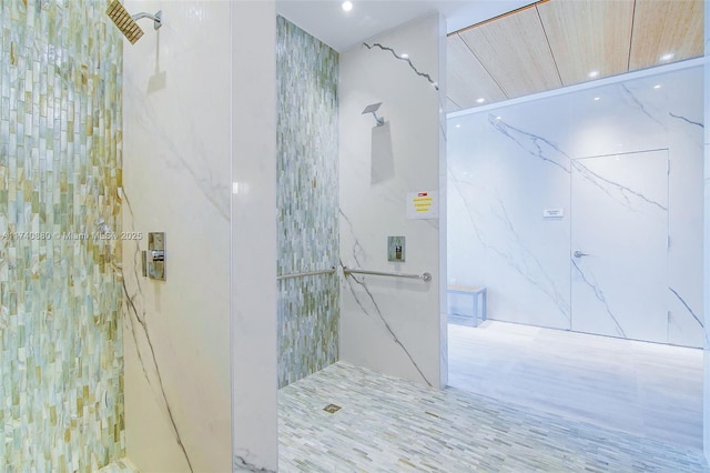 bathroom featuring a tile shower