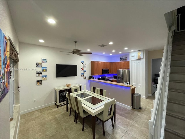 dining space featuring ceiling fan