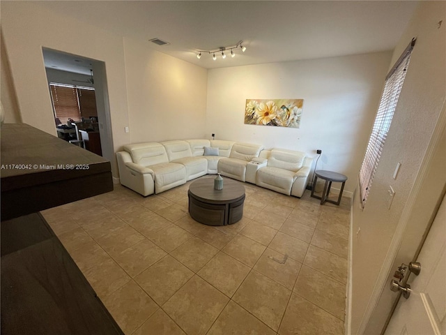 living room with light tile patterned floors