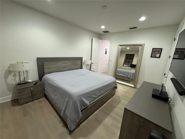 bedroom with light hardwood / wood-style floors