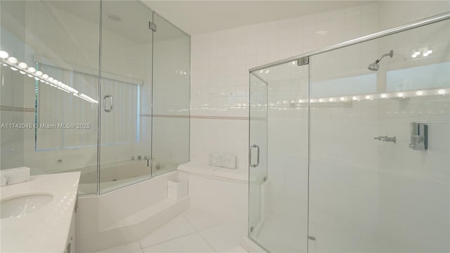 691 Ridgewood Rd, Key Biscayne, FL 33149 - full bath featuring tile patterned floors, combined bath / shower with glass door, and vanity