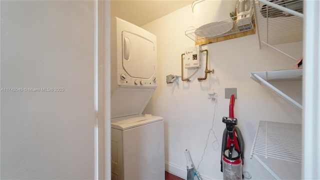 691 Ridgewood Rd, Key Biscayne, FL 33149 - washroom with stacked washer and clothes dryer and laundry area