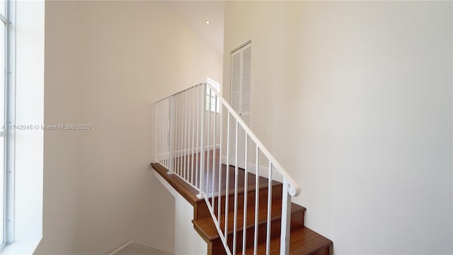 691 Ridgewood Rd, Key Biscayne, FL 33149 - stairs featuring a towering ceiling