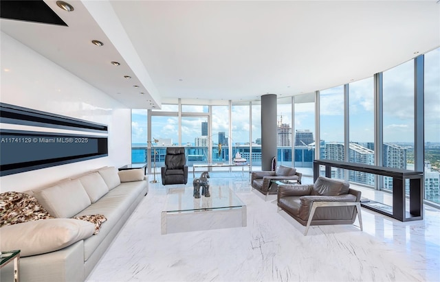 living room featuring floor to ceiling windows and a wealth of natural light