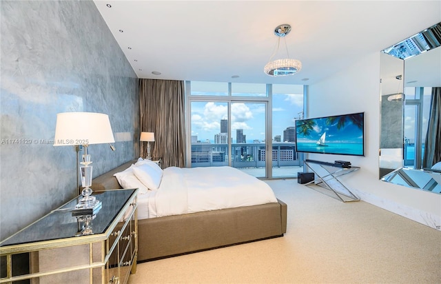 carpeted bedroom with a wall of windows