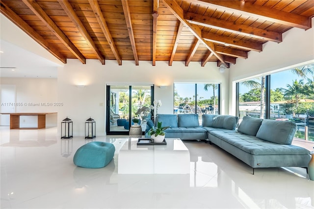 unfurnished living room featuring tile patterned floors, plenty of natural light, wooden ceiling, and vaulted ceiling with beams