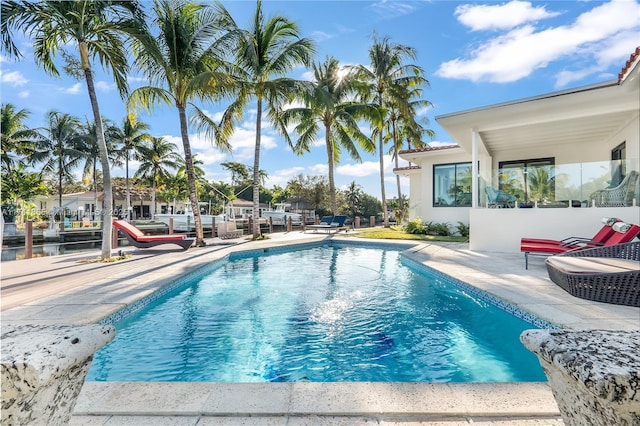 pool with a patio area