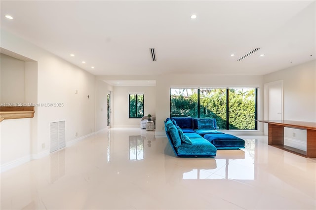 living area featuring recessed lighting, a healthy amount of sunlight, and visible vents