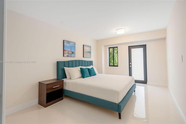 12905 Cherry Rd, North Miami, FL 33181 - bedroom with baseboards and light tile patterned floors