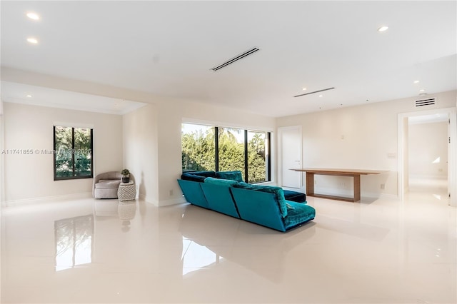 tiled living room with a wealth of natural light