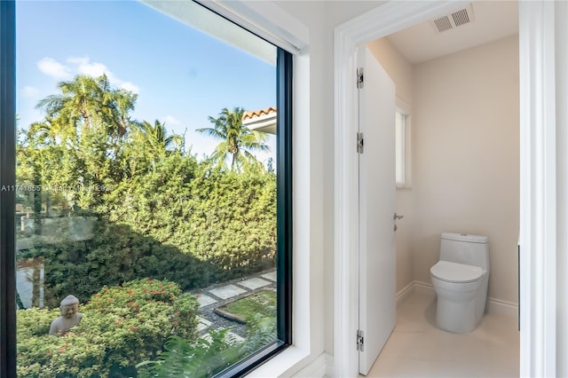 bathroom featuring tile patterned floors and toilet