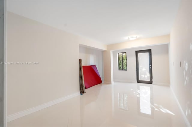 foyer entrance with baseboards