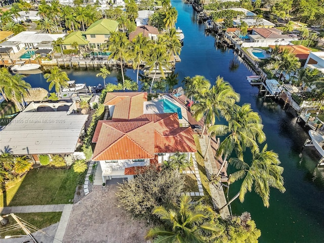 aerial view with a residential view and a water view