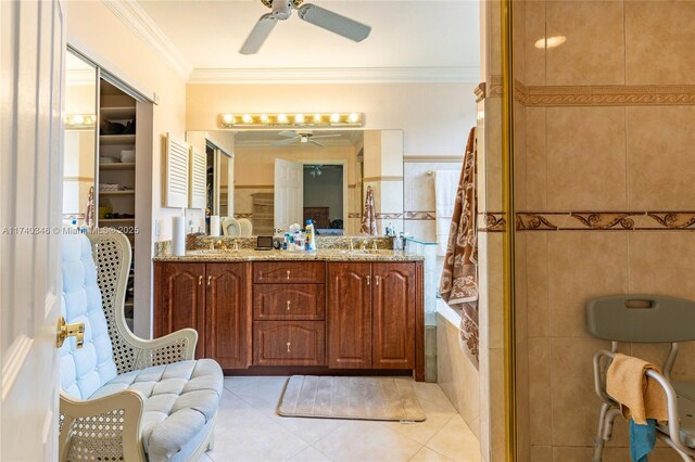 bathroom featuring tile walls, vanity, ceiling fan, tile patterned flooring, and ornamental molding