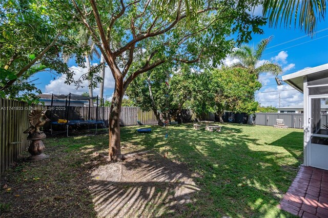 view of yard with a trampoline