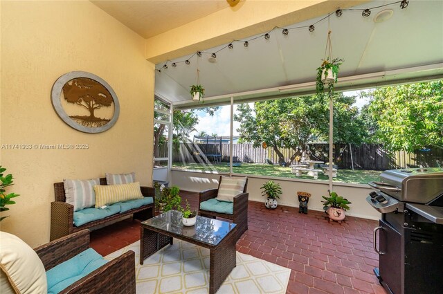 view of patio / terrace with grilling area and an outdoor hangout area