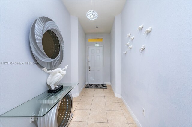 doorway to outside featuring light tile patterned floors