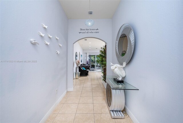 hallway featuring light tile patterned flooring