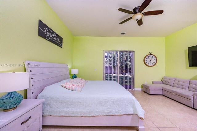 tiled bedroom featuring ceiling fan and access to exterior