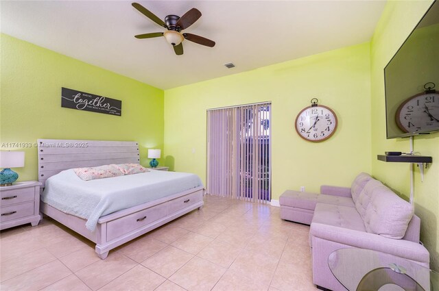 tiled bedroom featuring ceiling fan and access to outside