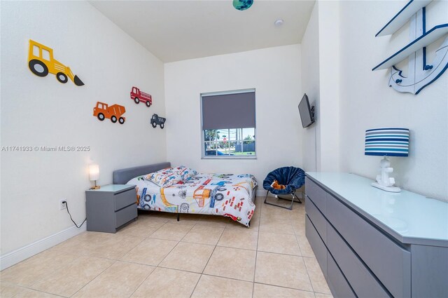 bedroom featuring light tile patterned floors