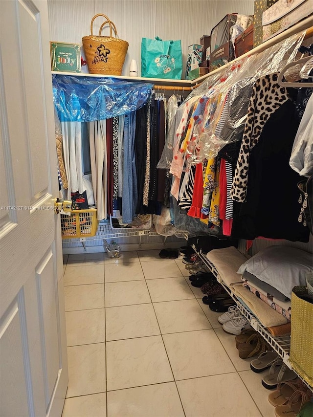 spacious closet featuring tile patterned flooring