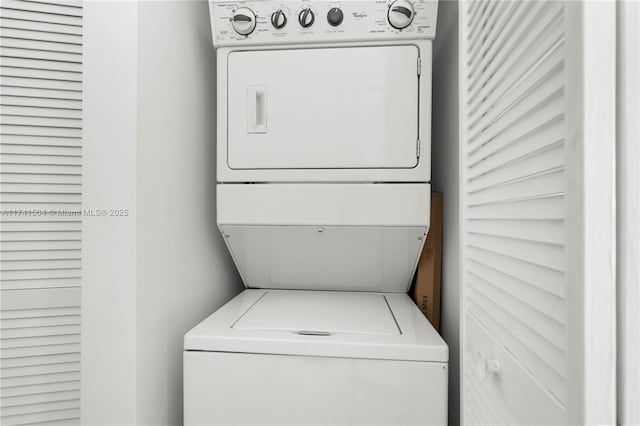 laundry room featuring stacked washer / dryer