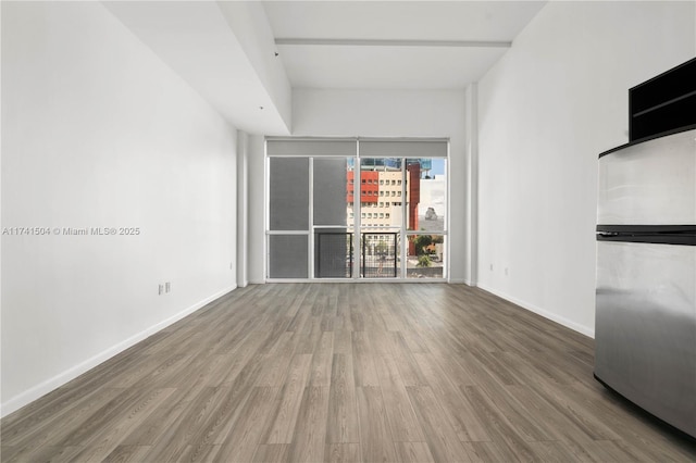 unfurnished living room featuring hardwood / wood-style floors